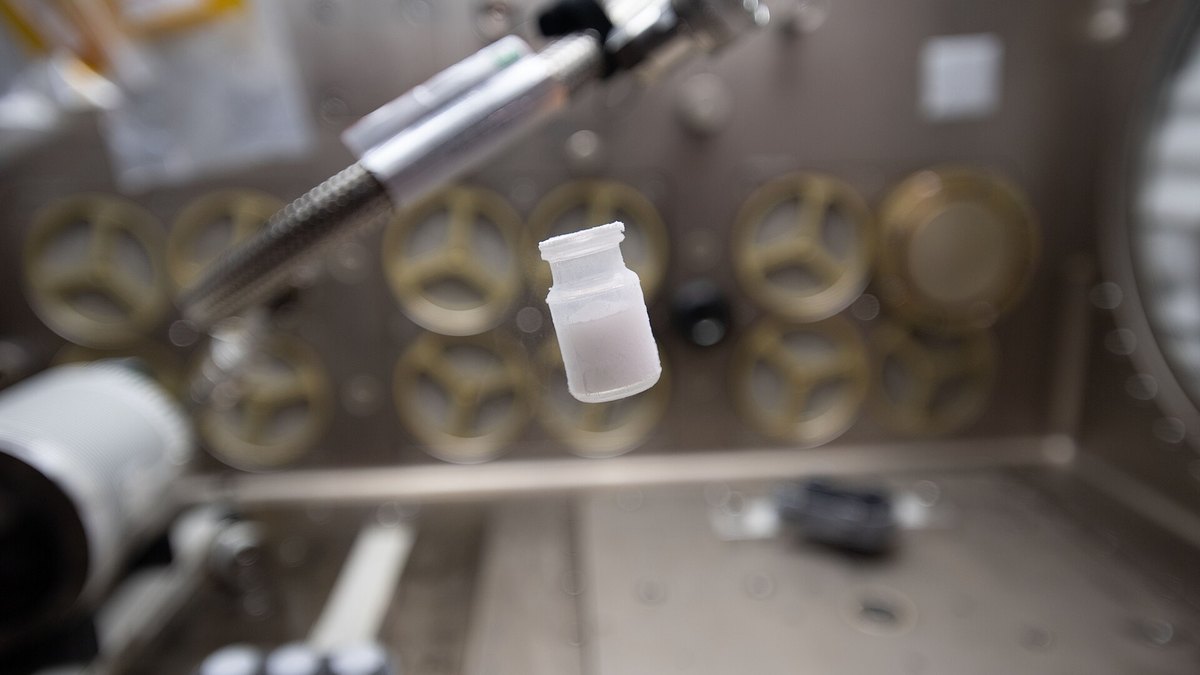 Freeze-dried peptide cake in a glass vial handled inside a sealed inert-gas glovebox before OxyDeplete (Oxygen-Depleted Sealed) — a Panacea Bio Chem technology by Bogdan Dicoias